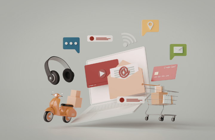 Portátil con iconos de compra online, email, vídeo y carrito, representando una estrategia de ecommerce y ventas digitales